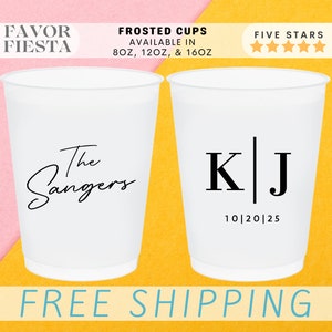 May include: Two white frosted cups with personalized designs. The first cup says "The Singers" in a script font. The second cup has the initials "K|J" with the date "10|20|25" underneath. The cups are available in 8, 12, and 16 ounce sizes.