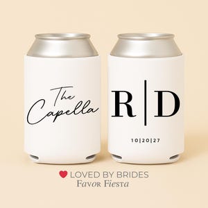 May include: Two white can coolers with silver tops. One cooler has the text "The Capella" in a script font. The other cooler has the initials "RD" with the date "10|20|27".