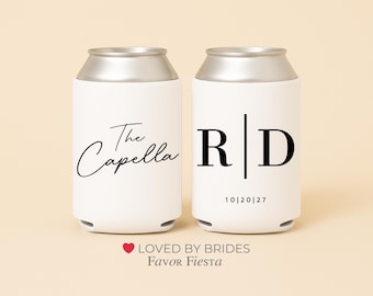 May include: Two white can coolers with silver tops. One cooler has the text "The Capella" in a script font. The other cooler has the initials "RD" with the date "10|20|27".