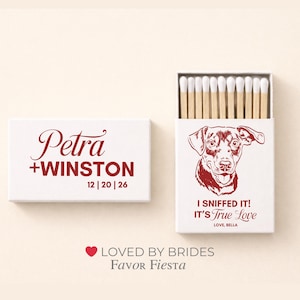 May include: White matchbox with red text reading "Petra + Winston" and the date "12 | 20 | 26." The open matchbox features a red dog illustration and the text "I sniffed it! It's True Love."