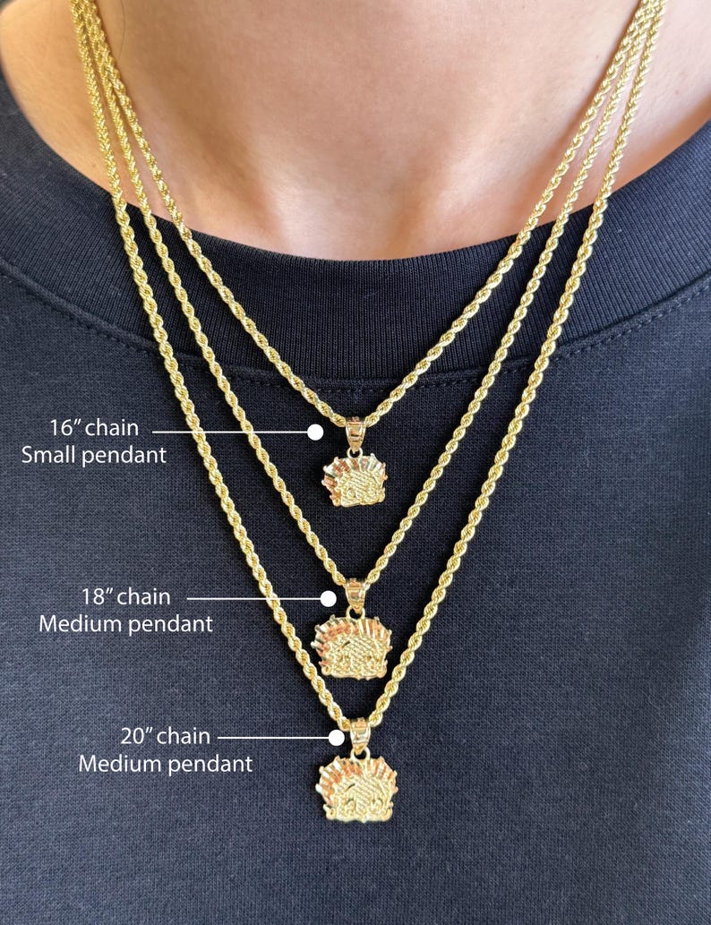 May include: Three gold rope chains with pendants. The chains are 16 inches, 18 inches, and 20 inches long. The pendants are small and medium in size.