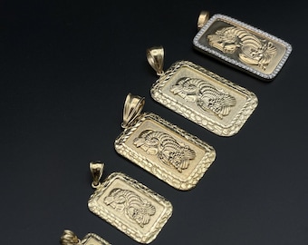 May include: Gold-toned rectangular pendants with a detailed ram design. The pendants vary in size and feature textured borders. One pendant has a diamond-studded border. The pendants are displayed against a black background.