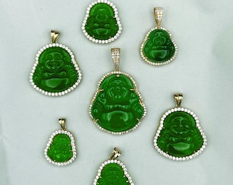 May include: Seven green jade Buddha pendants with gold accents and diamond-like accents. The pendants are on a white background.