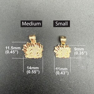 May include: Two gold-colored pendants, one larger and one smaller, with a cartoon character design. The larger pendant measures 1.15 inches in height and 0.55 inches in width. The smaller pendant measures 0.35 inches in height and 0.43 inches in width.