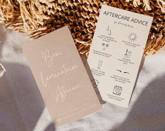 May include: Two cards with instructions for brow lamination aftercare. The first card is brown with white text that says "Brow Lamination Aftercare". The second card is beige with black text and icons that say "Aftercare Advice for stunning brows". The icons include a drop of water, a sun, a makeup brush, a tube of cream, a hand with a finger pointing, and a calendar with a heart.
