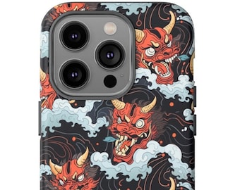 May include: A black phone case with a repeating pattern of red and orange Japanese demon masks on a dark blue background with white waves.