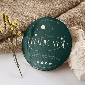 May include: A round, green thank you sticker with a white star and the text "THANK YOU" in a white, stylized font. The sticker also includes the text "FOR YOUR PURCHASE! CAN'T WAIT TO SEE YOU AGAIN!" and a website address.