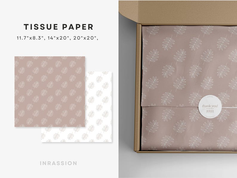 Puede incluir: Papel de seda con un delicado patr&oacute;n de hojas blancas sobre un fondo rosa claro. El papel de seda est&aacute; doblado y colocado dentro de una caja de cart&oacute;n marr&oacute;n. La caja tiene una pegatina blanca con el texto "&iexcl;gracias!" en ella.