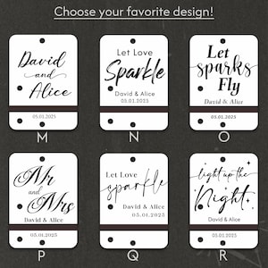 May include: White rectangular tags with various phrases in elegant script, including "David and Alice," "Let Love Sparkle," and "Let Sparks Fly." Each tag has a dark brown band and the date 05.01.2025. The text "Choose your favorite design!" is at the top.