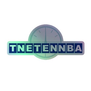 May include: A rectangular sticker featuring the dark blue text TNETENNBA set against a background of a circular clock face with a subtle iridescent, holographic finish that shifts in color across the surface of the design.