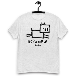 May include: A gray t-shirt with a black cartoon dog and the text "SCRAMBLE SOHO" printed on the front.