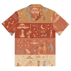 May include: A short-sleeve button-down shirt in shades of orange and tan, featuring a repeating pattern of extraterrestrial motifs, including flying saucers, alien figures, pyramids, palm trees, constellations, and ancient Egyptian symbols.