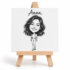 May include: A black and white caricature illustration of a person with shoulder-length wavy hair, wearing a blazer and trousers, standing with hands in pockets. The name Anna is written in black script above the figure on a white canvas on an easel.