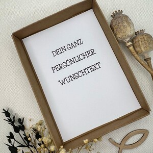 May include: A brown paper frame with a white card inside. The card has the text "Dein Ganz Pers&ouml;nlicher Wunschtext" printed on it.