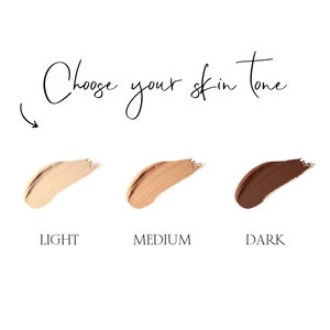 May include: Choose your skin tone. Three swatches of foundation makeup: light, medium, and dark.
