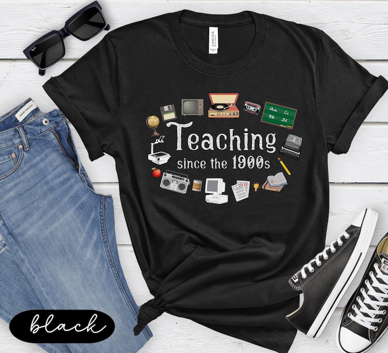 May include: Black t-shirt featuring a vintage-style graphic of school supplies and the text "Teaching since the 1900s".