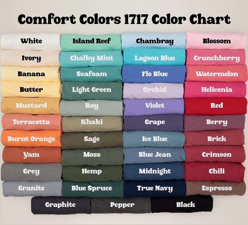 May include: Color chart displaying Comfort Colors 1717 t-shirt colors. The chart features a variety of colors, including white, blue, pink, green, and orange. Each color is labeled with its name in white text.