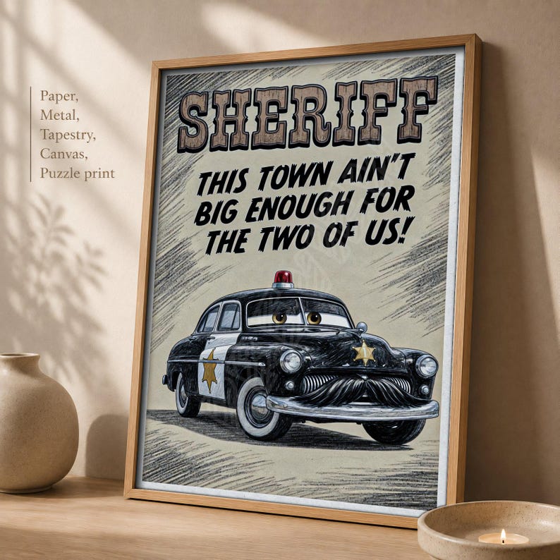May include: A framed wall art print featuring a black and white police car with a mustache and eyes on the windshield. The text reads SHERIFF THIS TOWN AIN'T BIG ENOUGH FOR THE TWO OF US! The illustration has a sketch-like background texture.