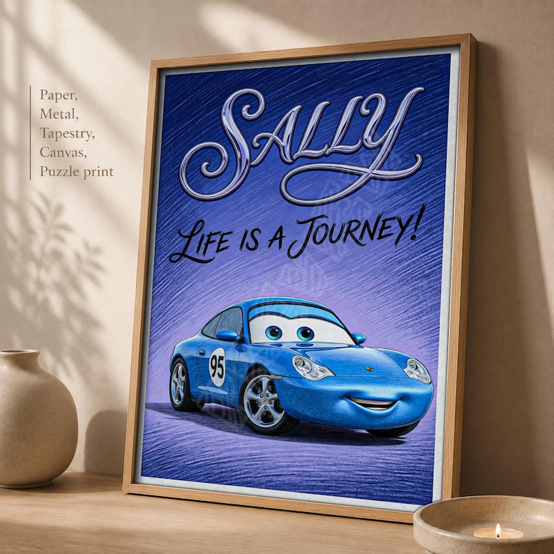 May include: A framed rectangular print featuring a blue cartoon car with large eyes on the windshield. The text Sally and Life is a Journey! appears in stylized script above the car. The background has a textured blue cross-hatched pattern.