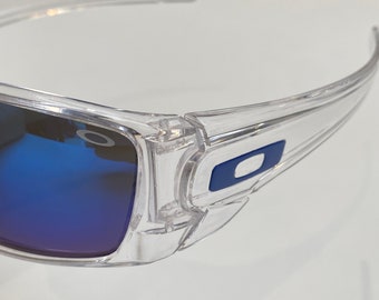 Gas Can Style Sunnies - Clear frame, blue logo, blue lense. Logo on middle of frame and lense