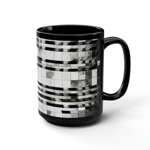 May include: Black ceramic mug with a white and gray geometric pattern.