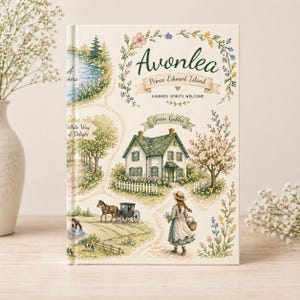 May include: A hardcover book with a watercolor illustration of a landscape. The cover features the text "Avonlea Prince Edward Island" and "Kindred Spirits Welcome". The artwork includes a house, a lake, and a horse-drawn carriage.
