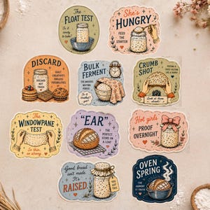 May include: A set of colourful stickers with baking-themed illustrations and text. Designs include phrases like "The Float Test," "She's Hungry," and "Oven Spring." The stickers feature images of bread, jars, and baking tools.
