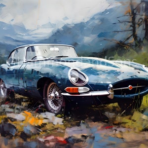 May include: A teal blue classic car parked in a field with a mountain range in the background.