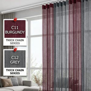 May include: Burgundy and grey thick chain series curtains hanging in front of a window. The burgundy curtains are on the left, and the grey curtains are on the right. The text "C11 BURGUNDY" and "C12 GREY" are visible.