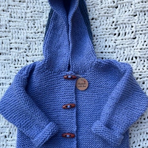 Hand knitted hooded baby jacket (6-9m)