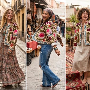 Könnte beinhalten: Drei Frauen tragen farbenfrohe, bestickte Jacken mit floralen Mustern. Die Jacken haben eine cremefarbene Basis mit roten, rosa und grünen Stickereien. Eine Frau trägt einen langen Paisley-Rock, eine andere Jeans und die dritte ein beiges Kleid. Die Jacken sind im Bohème-Stil.