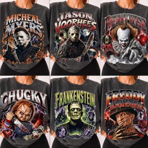May include: A collection of six charcoal grey crewneck sweatshirts featuring vintage-style graphic prints of horror movie characters including Michael Myers, Jason Voorhees, Pennywise, Chucky, Frankenstein, and Freddy Krueger with bold text.