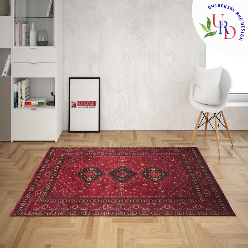 May include: A red, black, and cream patterned rug with a traditional design. The rug has a dark border and a central diamond shape.