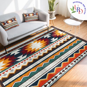 May include: A colorful geometric patterned rug with shades of red, orange, yellow, green, blue, and brown. The rug has a white background and features a variety of geometric shapes, including triangles, squares, and diamonds.