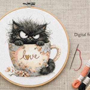 May include: Cross-stitch embroidery of a grumpy black cat in a floral teacup with the word "love". The embroidery is in a wooden hoop, with spools of thread and a needle nearby. The text "Digital file / PDF" is also present.
