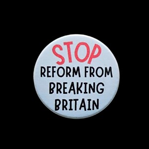 May include: A white circular badge with the words "STOP" in red, above "REFORM FROM BREAKING BRITAIN" in black. The background is black.