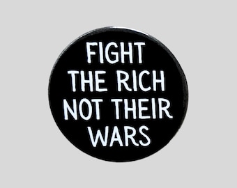 May include: A round, black button with the white text "FIGHT THE RICH NOT THEIR WARS". The button is centered on a light gray background. The text is in a bold, sans-serif font.