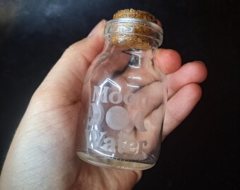 Oppsie small rounded moon water jar. Witches storage glass