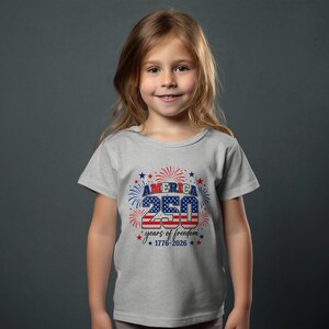 Girl in gray t-shirt celebrating America's 250 years of freedom.
