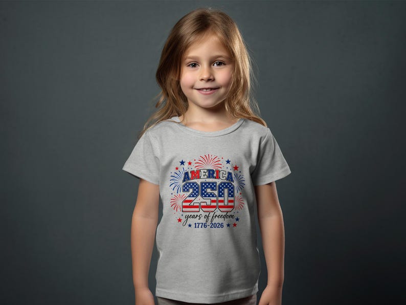 Girl in gray t-shirt celebrating America's 250 years of freedom.