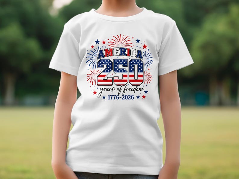 White t-shirt with "America 250 1776-2026" and fireworks graphic.