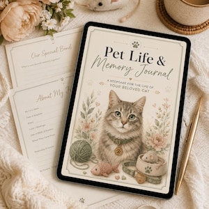 Peut inclure: Un journal Pet Life & Memory avec une couverture crème illustrée d'un chat tigré, de fleurs, d'une pelote de laine et d'un poisson jouet. Le texte indique Pet Life & Memory Journal, A KEEPSAKE FOR THE LIFE OF YOUR BELOVED CAT. Pages incluses.