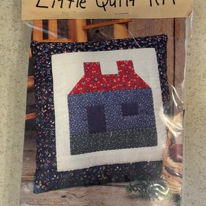 Little Quilt Kit for making a Country Cabin 9x9 pillow, featuring a log cabin quilt block design.
