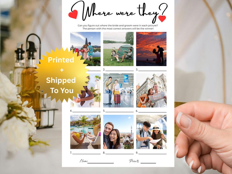 May include: A white paper game card titled Where were they? with two red hearts, featuring nine numbered photo squares of a couple in various travel locations, blank lines for answers, and a gold starburst graphic with Printed + Shipped To You.