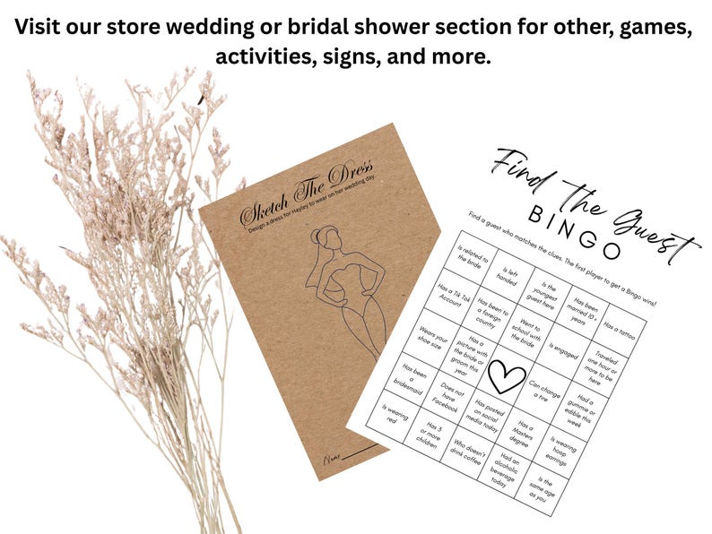 May include: A kraft paper card titled Sketch The Dress with a line drawing of a person in a veil, and a white Find The Guest Bingo game card with black text and a heart icon. Dried light beige flowers are positioned to the left of the cards.