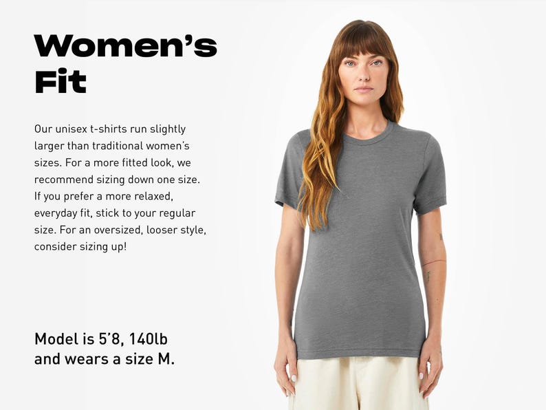 a woman wearing a gray shirt and white pants