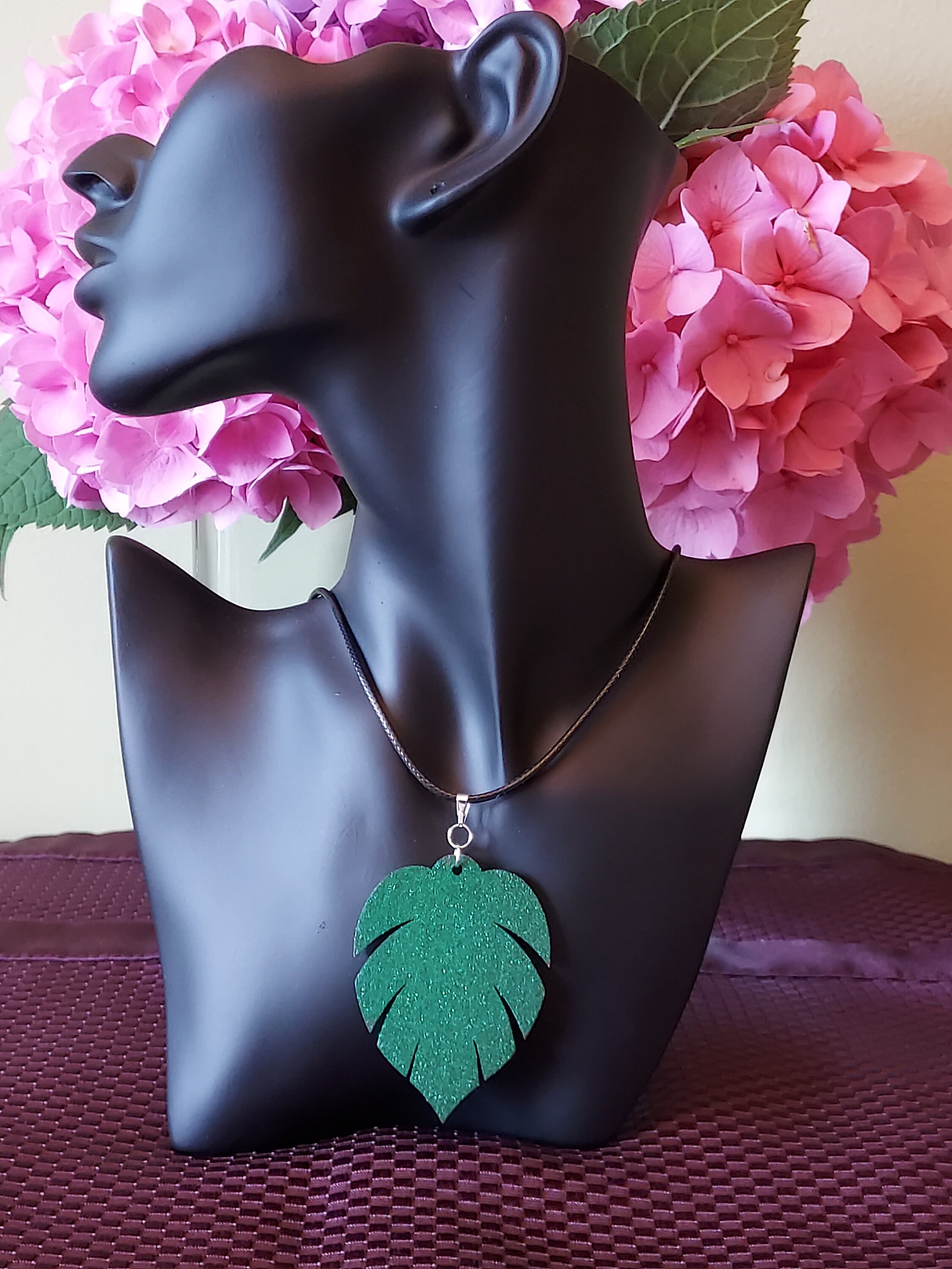 2" x 2.5" inch gorgeously detailed... laser cut monstera leaf pendant hand decorated in a green bling.