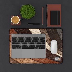 May include: A brown, white and beige leather desk mat with a laptop, mouse and a small sign that says "Give Me Grace".