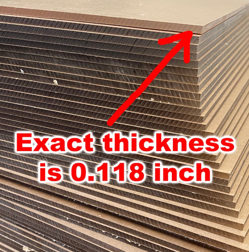 Puede incluir: Primer plano de una pila de paneles de madera marr&oacute;n. El texto "Exact thickness is 0.118 inch" es visible en la imagen.