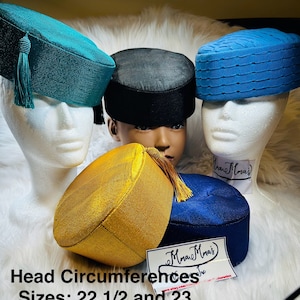May include: A collection of colorful, textured hats in teal, black, blue, gold, and navy. Each hat is displayed on a mannequin head. Some hats have tassels. The text on the image reads "Head Circumferences Sizes: 22 1/2 and 23".